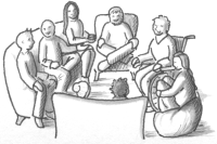 A group of people sitting in a meeting.